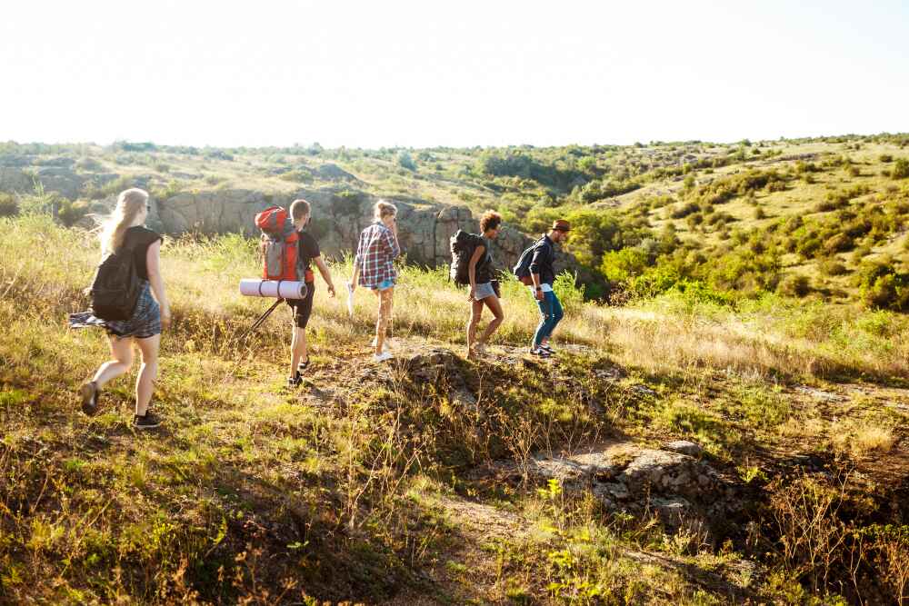 Hikers walking across an open field