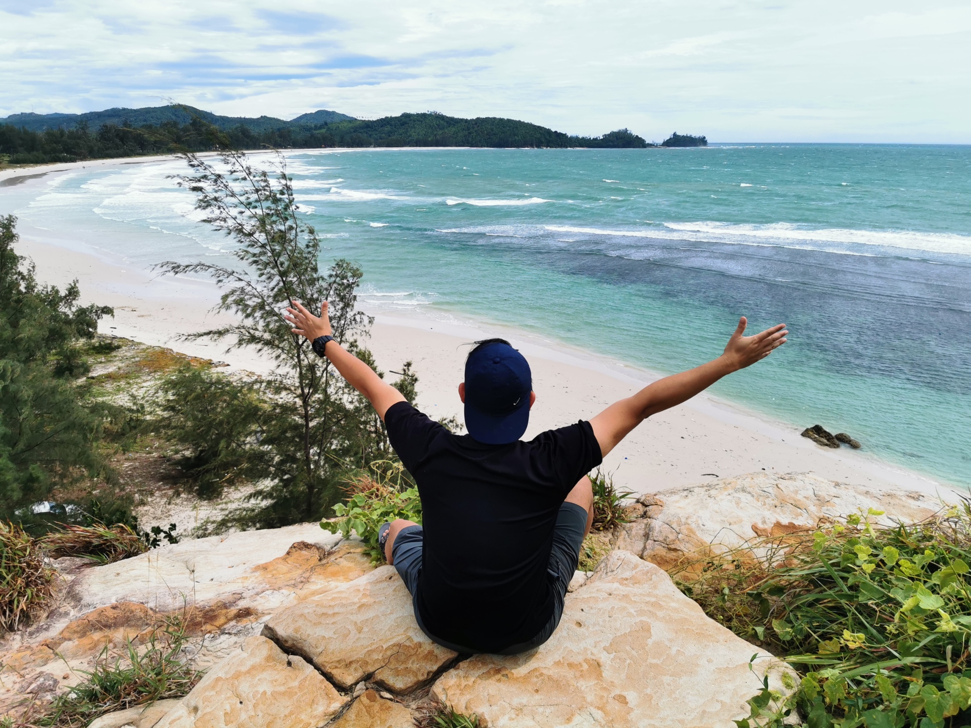 Visitor overlooking the sea at the Tip of Borneo